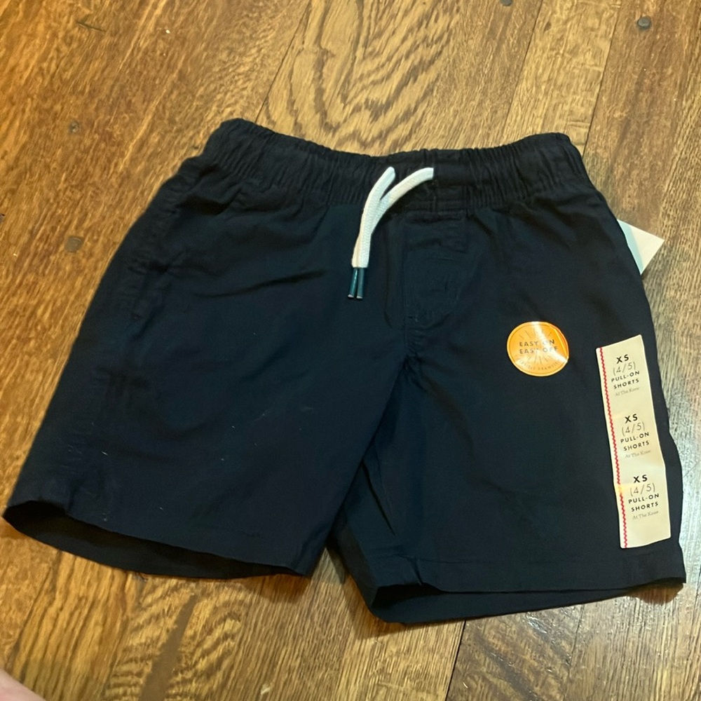 Cat and jack pull on shorts